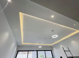 Gypsum ceiling installation work in Dubai showing modern false ceiling design with smooth finishing